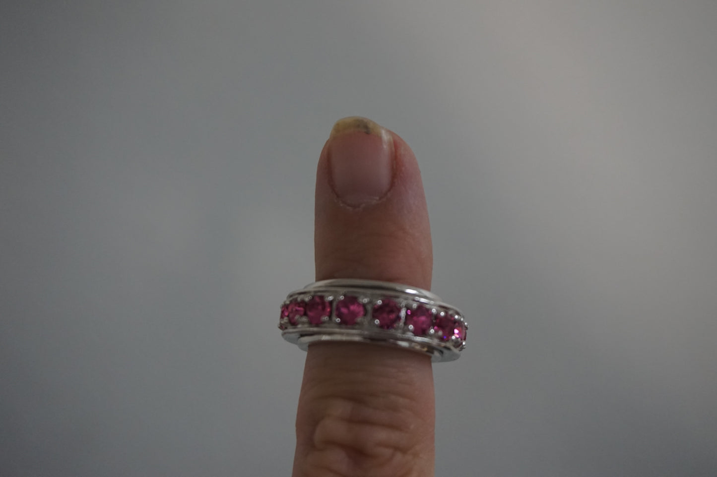 Pink jeweled fidget spinner ring